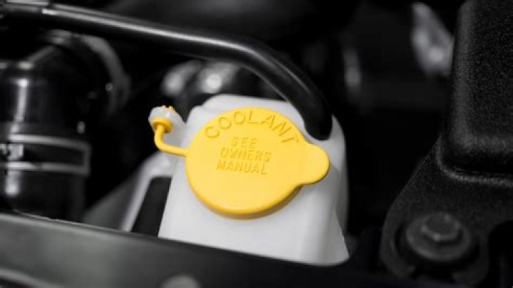 Can I add coolant to a warm engine?